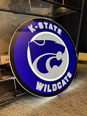 KSU LED wall sign top text reads "K-State" bottom text reads "Wildcats"