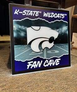 KSU LED wall sign top text reads "K-STATE WILDCATS" bottom text reads "FAN CAVE"