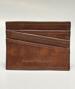 The outside of the wallet is brown with purple lining and four card slots