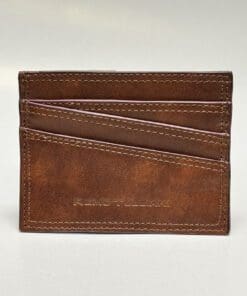 The outside of the wallet is brown with purple lining and four card slots
