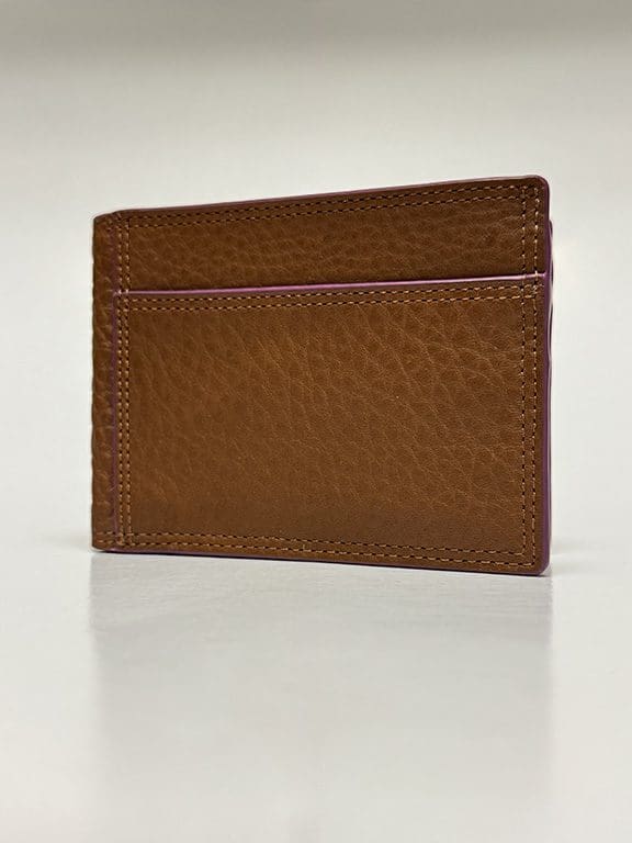 Outside of wallet brown with purple lining and single card slot